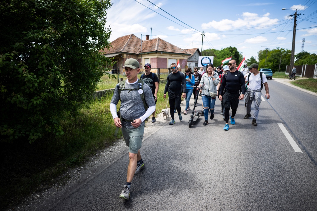 Hungarian opposition leader, Peter Magyar, walks with his supporters to Oradea in a bid to gain support of ethnic Hungarians in Tapioszentmarton's Romania, Hungary. (Reuters)