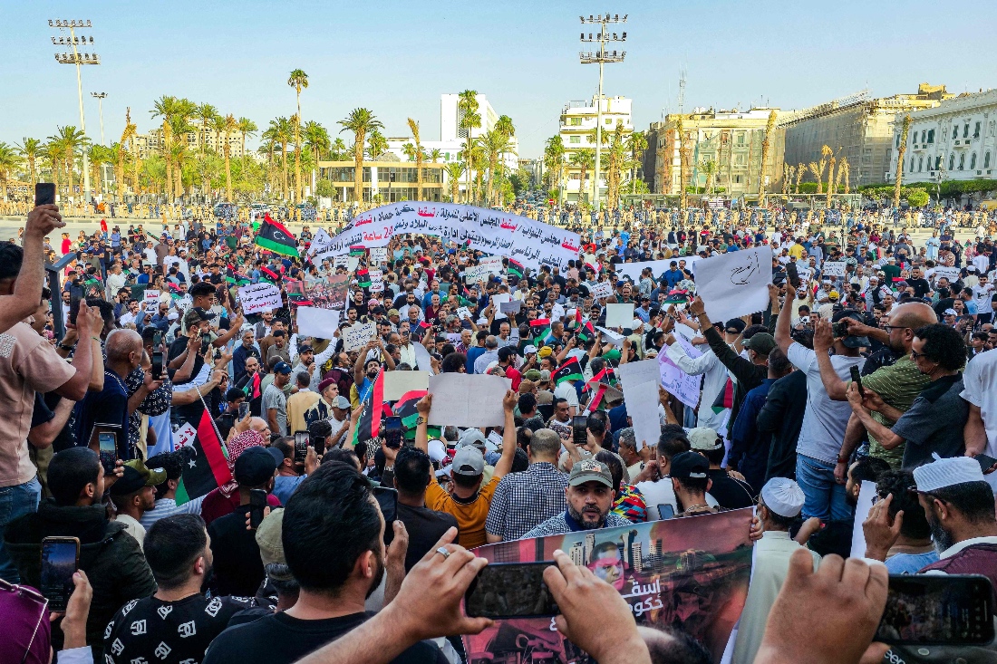 Demonstrators gather at an anti government protest calling for Abdulhamid Dbeibah's resignation in Tripoli, Libya. (AFP)