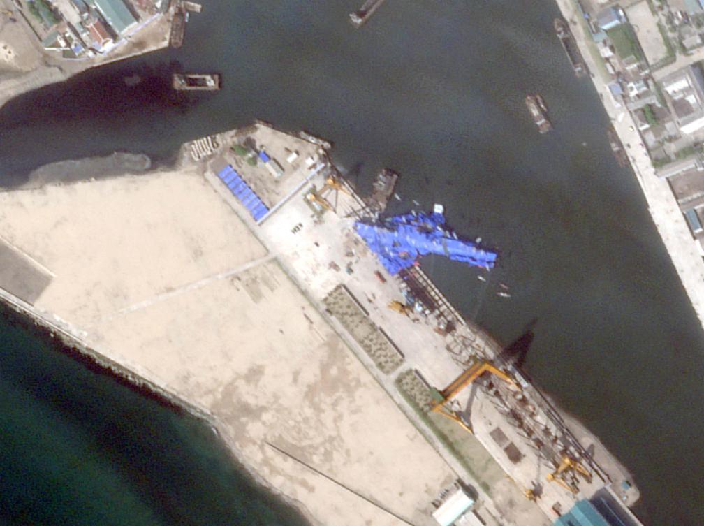 Law enforcement authorities detained the chief engineer, head of the hull construction workshop and deputy manager for administrative affairs at Chongjin Shipyard for the failed naval destroyer launch. (Planet Labs PBC/AFP)