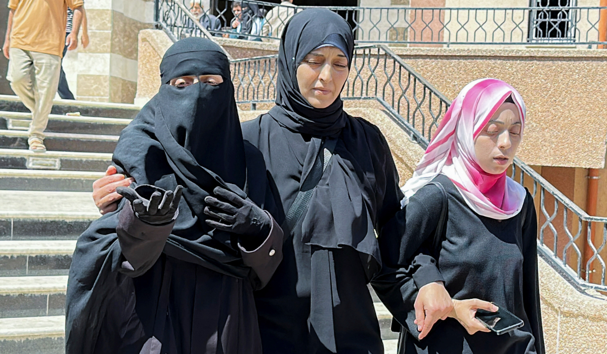 Palestinian Paediatrician Alaa Al-Najjar (L), who lost lost nine of her children in an Israeli strike on Friday, according to medics, reacts at Nassser hospital in Khan Younis, in the southern Gaza Strip, May 25, 2025. (REUTERS)