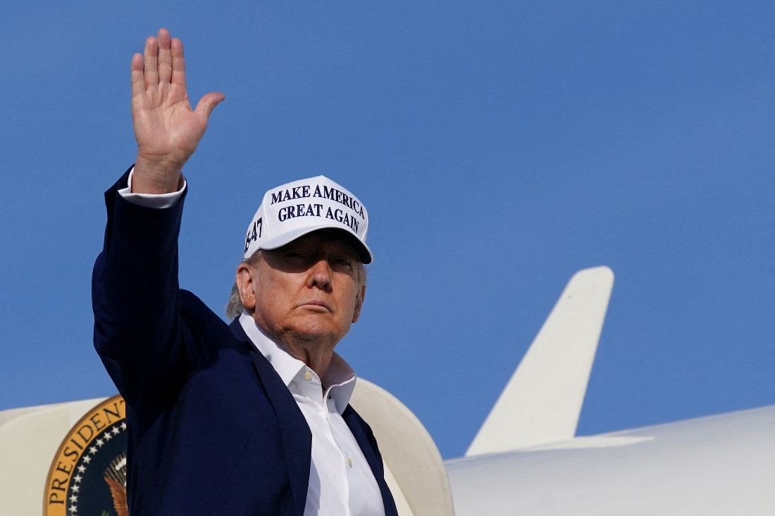American President Donald Trump waves as he boards Air Force One in New Jersey, US. (Reuters)