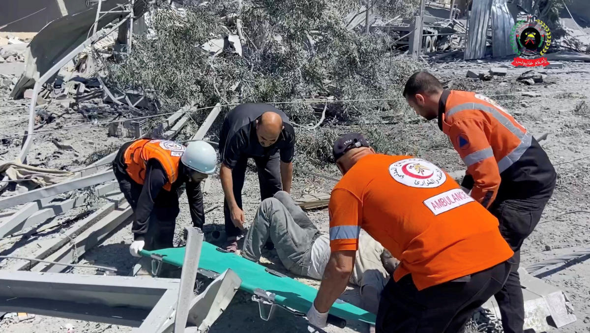 Rescuers place a casualty to transport them on a stretcher, in Khan Younis, Gaza, May 23, 2025, in this screengrab taken from video. (Reuters)