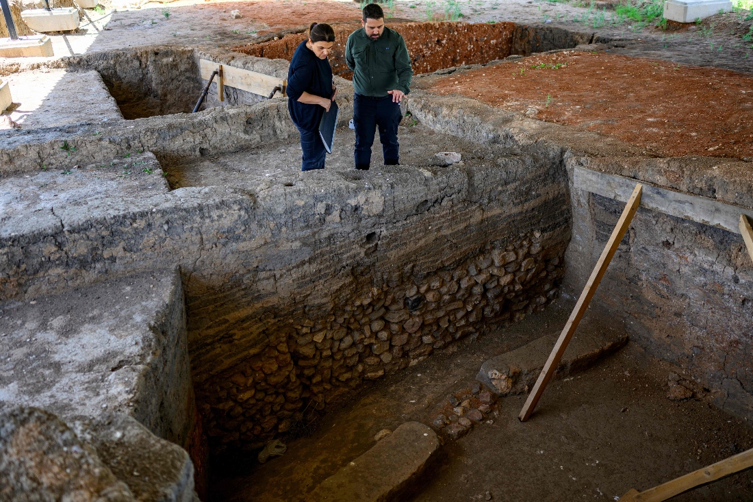 Archaeologists look at an ancient house at the Kulluoba excavation site, in Eskisehir province, Turkiye. (AFP)