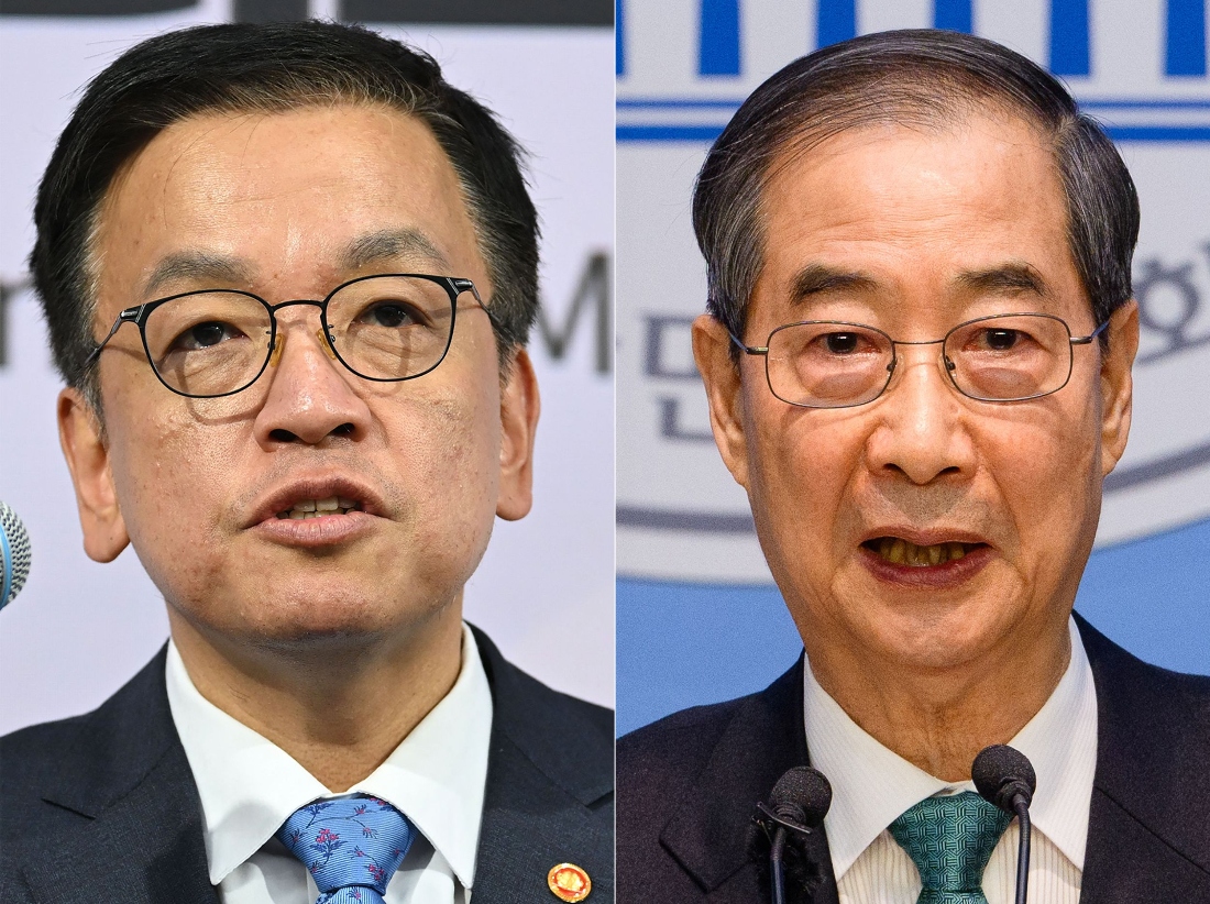 South Korea's Finance Minister Choi Sang-mok (L) and former acting president Han Duck-soo. (AFP)