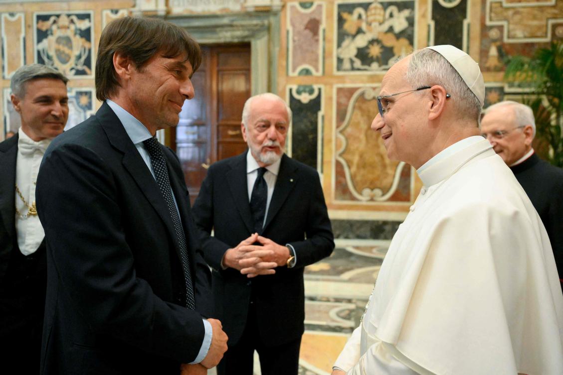 This photo taken and handout on May 27, 2025 by The Vatican Media shows Pope Leo XIV with Napoli’s Italian coach Antonio Conte during a meeting with the managers and players of the Napoli football team in the Vatican. (AFP)