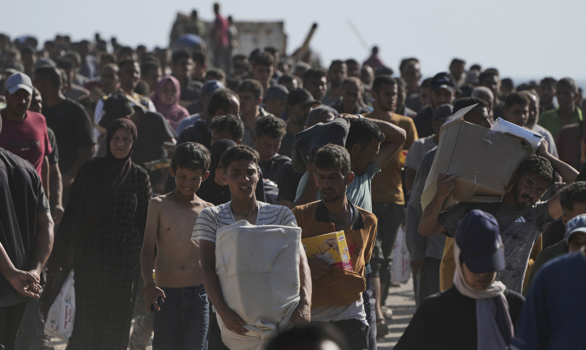 Palestinians carry boxes containing food and humanitarian aid packages delivered by the Gaza Humanitarian Foundation, a U.S.-backed organization approved by Israel, in Rafah, southern Gaza Strip, on Tuesday, May 27, 2025. (AP)