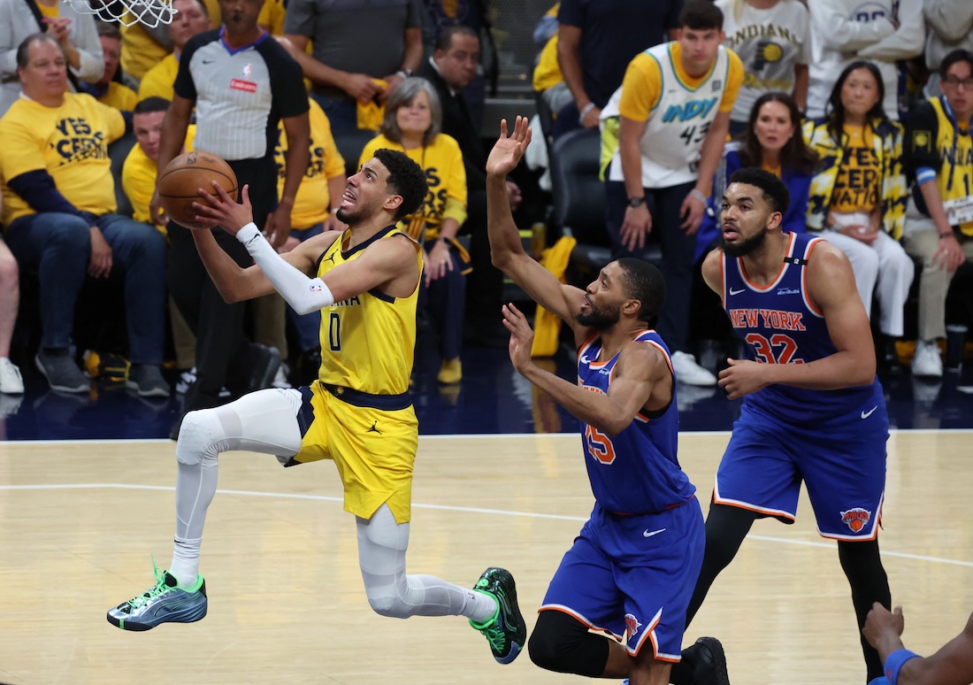 Indiana Pacers guard Tyrese Haliburton drives to the hoop past New York Knicks forward Mikal Bridges (25) during the fourth quarter of Game 4 of the Eastern Conference finals for the 2025 NBA Playoffs at Gainbridge Fieldhouse Tuesday. (Trevor Ruszkowski-Imagn Images)