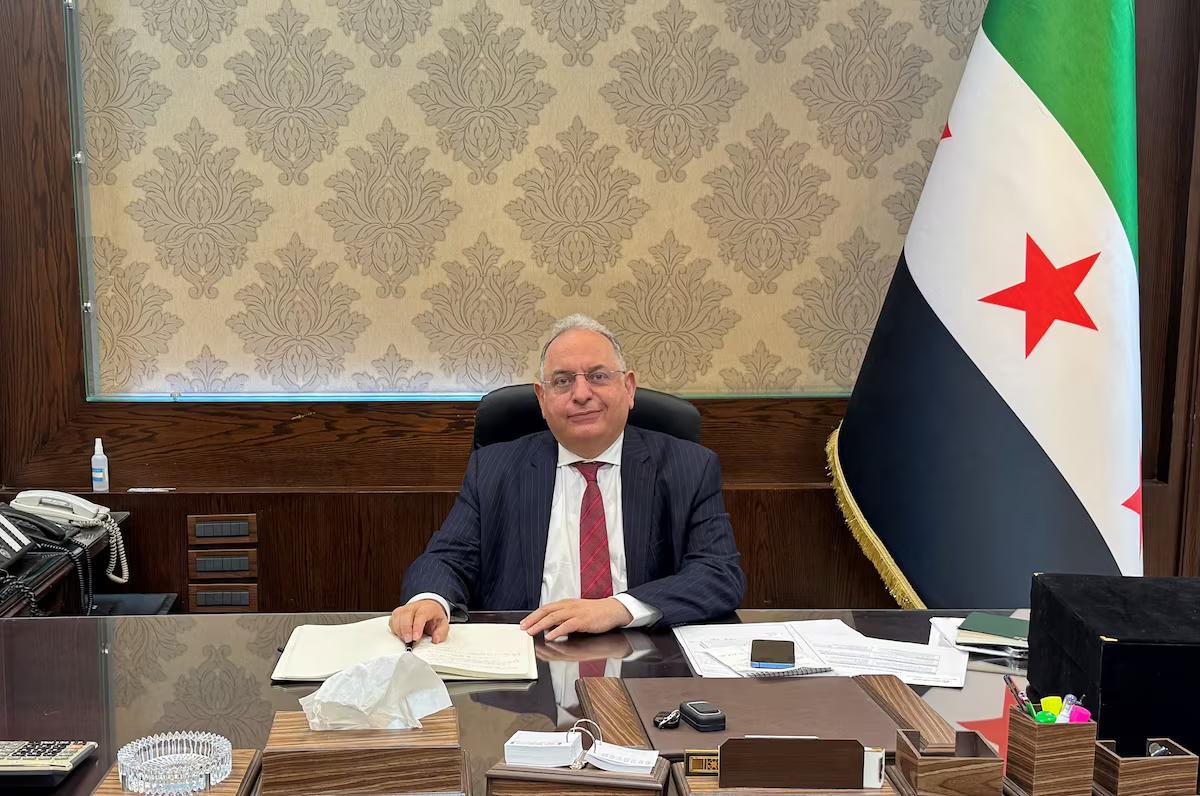 Syrian Finance Minister Yisr Barnieh attends an interview with Reuters at his office at the finance ministry in Damascus. File/Reuters