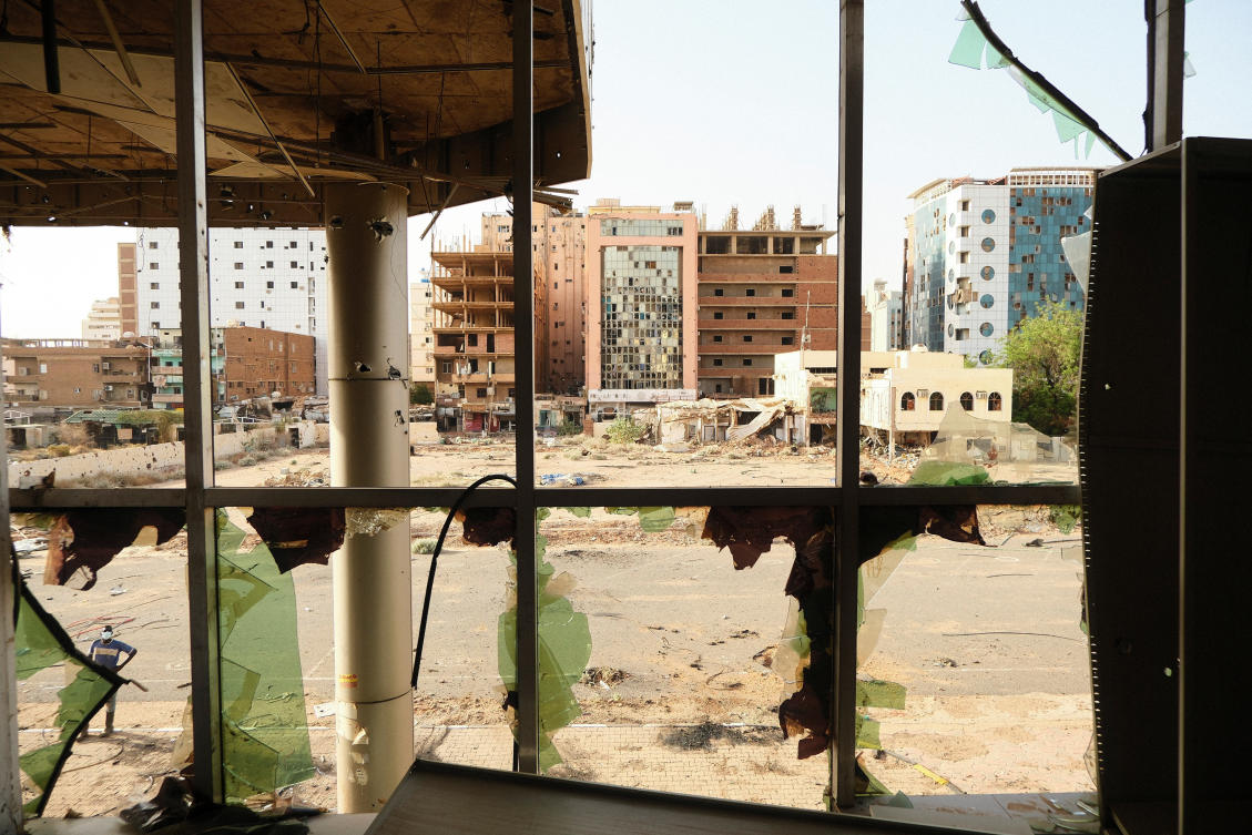 Most of the main buildings in downtown Khartoum, above, are charred and once-wealthy neighborhoods are ghost towns with destroyed cars and unexploded shells dotting the streets. (Reuters)