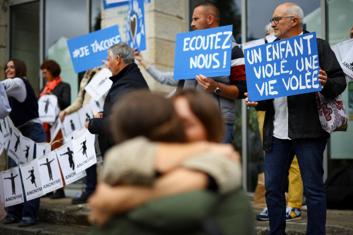 Victims and protesters gather in front of the courthouse where Joel Le Scouarnec was sentenced for the rape and sexual assault of hundreds of children over several decades, in Vannes, Brittany. (Reuters)