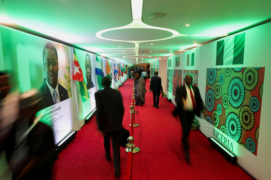 People walk into the Eko Conventional Hall where ECOWAS leaders will gather to celebrate the golden jubilee of the regional bloc in Nigeria’s commercial capital, Lagos, Nigeria, May 28, 2025. (Reuters)