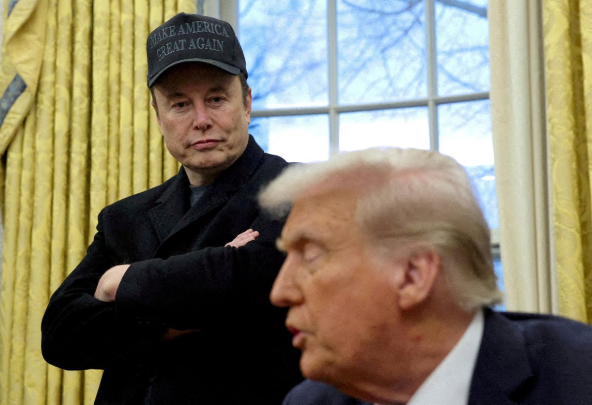 Elon Musk listens to President Donald Trump speak in the Oval Office of the White House in Washington on February 11, 2025. (REUTERS/File Photo)