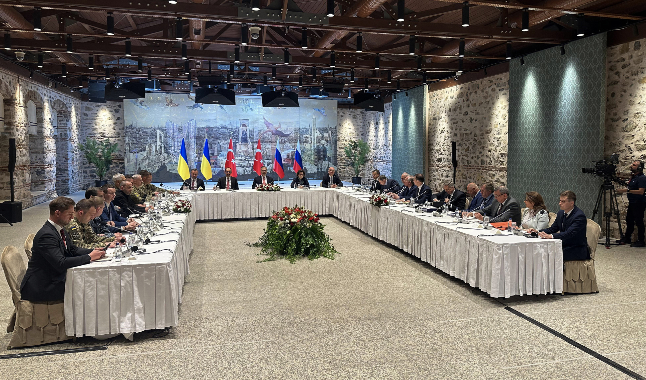 This handout photograph taken and released by Ukrainian Foreign Ministry on May 16, 2025, shows members of Ukrainian (L) and Russian (R) delegations attending a meeting at the Turkish Presidential office Dolmabahce, in Istanbul. (AFP/File)