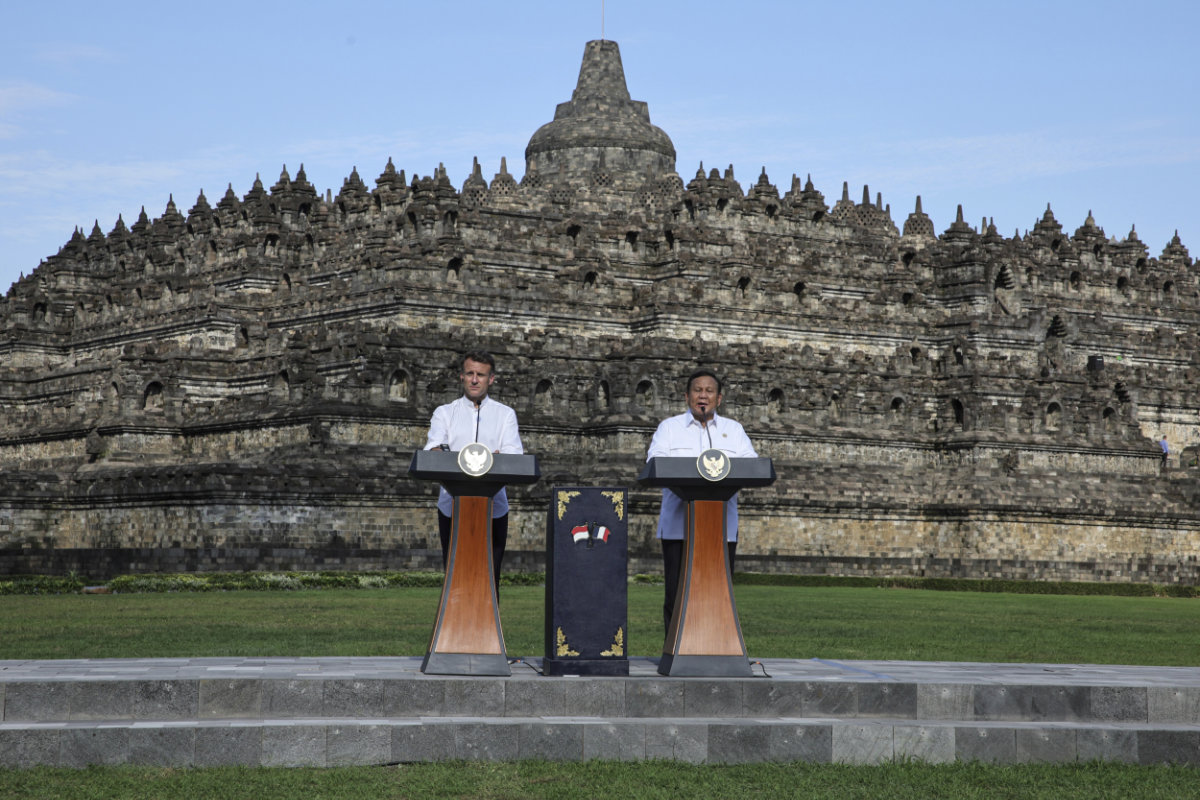 France's President Emmanuel Macron (L) and Indonesian President Prabowo Subianto speak during a visit at Borobudur Temple in Magelang, Central Java, on May 29, 2025. (Pool Photo via AP)