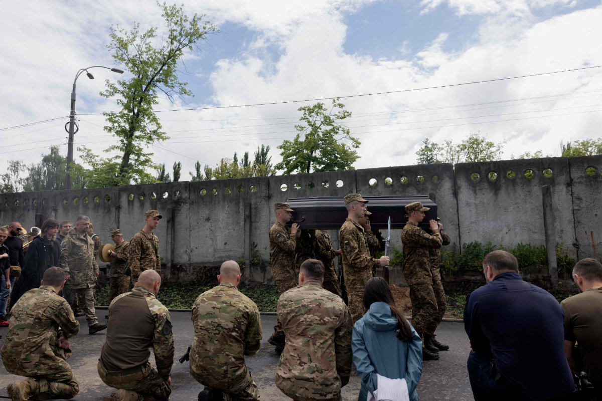 Ukrainian soldiers carry the coffin of 26-year-old Ukrainian serviceman Yaroslav Shvets, an actor and sapper, who died as a result of wounds received at the front, during the funeral ceremony in Kyiv on May 29, 2025, amid Russian invasion in Ukraine. (AFP)