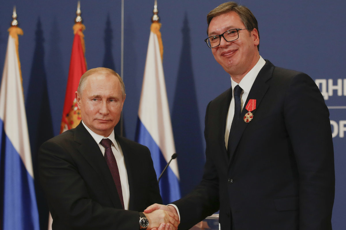 Russian President Vladimir Putin, left, shakes hands with Serbian President Aleksandar Vucic after being awarded the Order of Alexander Nevsky in Belgrade, Serbia, on Jan. 17, 2019. (AP Photo/File)
