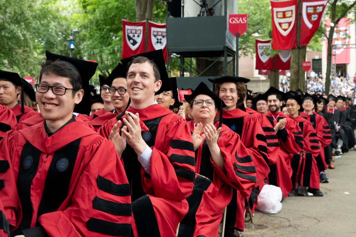 Harvard graduate students applaud during the 374th Harvard Commencement in Harvard Yard in Cambridge, Massachusetts, on May 29, 2025. (AFP)