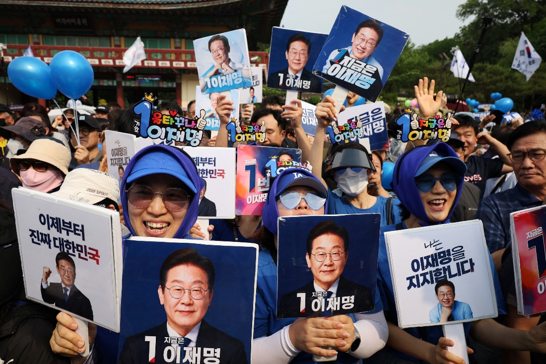 Supporters of Lee Jae-myung, the presidential candidate for the Democratic Party, cheer during a campaign rally at a park in Seoul, South Korea. (Reuters)