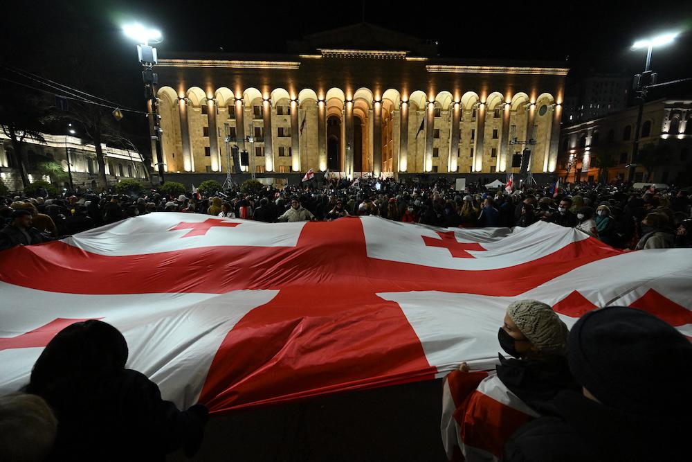 Above, Georgian pro-Europe demonstrators stage a rally outside the parliament building in Tbilisi on March 31, 2025. Prime Minister Irakli Kobakhidze earlier announced that Georgia would postpone EU membership talks until 2028. (AFP file photo)