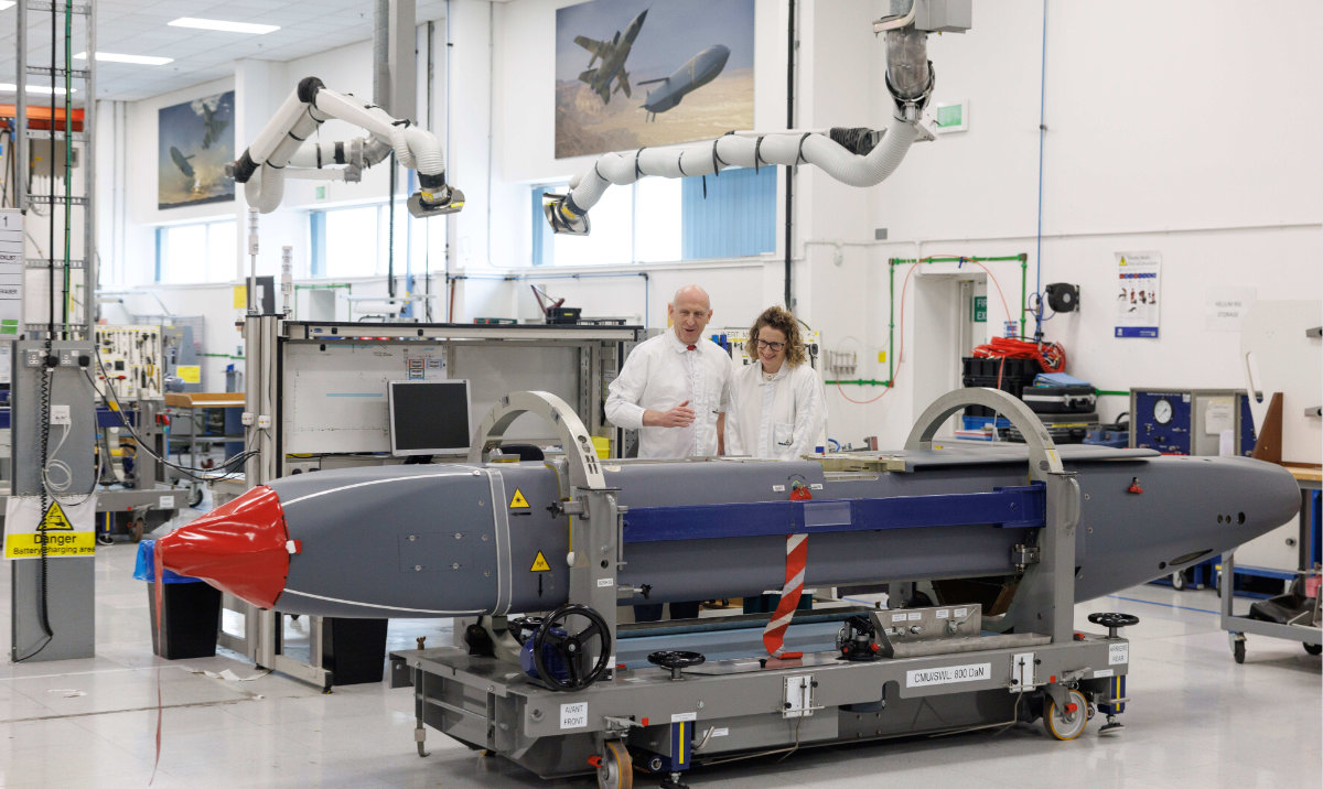 Louise Holmes, MBDA UK Deputy Managing Director, shows Britain's Defense Secretary John Healey, left, a storm shadow missile on an assembly line at the MBDA Storm Shadow factory in Stevenage, England, Saturday May 31, 2025. (AP)