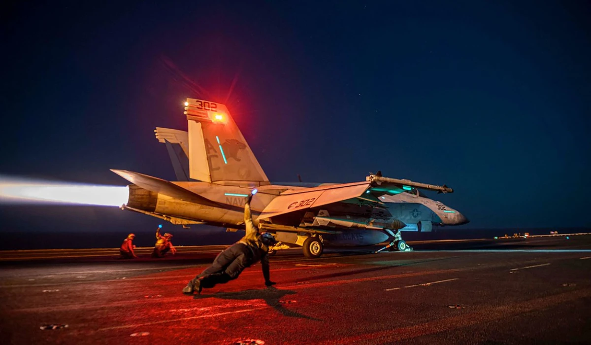 In this on February 24, 2024, image released by the US Central Command, a US fighter plane lauches from the deck of the aircraft carrier USS Eisenhower in the Red Sea during operations against Huthi targets. (AFP)