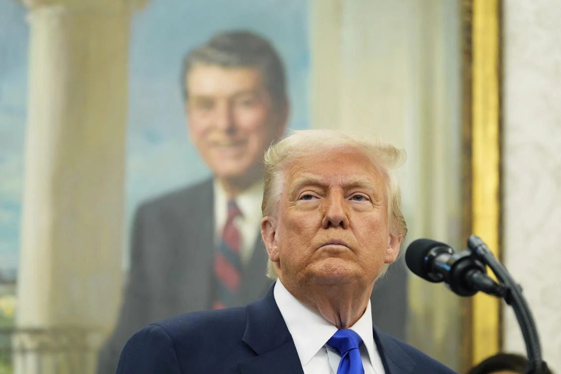 Donald Trump listens during an event to announce that the 2027 NFL Draft will be held on the National Mall, in the Oval Office of the White House, Monday, May 5, 2025, in Washington. (AP Photo)