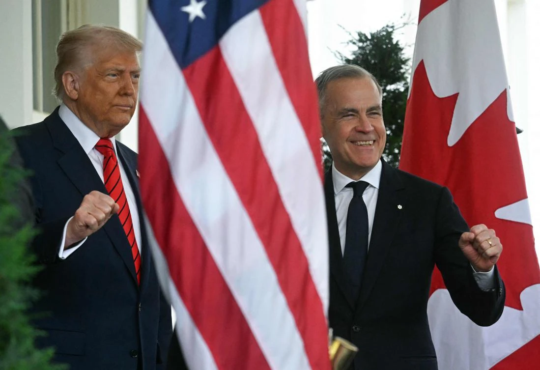 US President Donald Trump greets Canadian Prime Minister Mark Carney as he arrives at the White House in Washington, DC, on May 6, 2025. (AFP)
