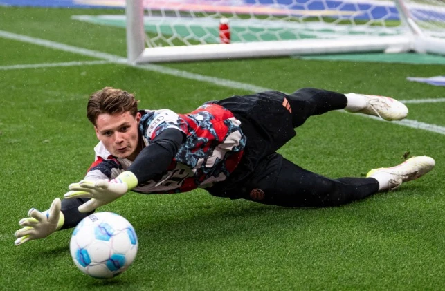 Bayern Munich keeper Jonas Urbig celebrated his first Bundesliga title on Sunday with his team sitting eight points clear at the top with two games left to play. (X/@FCBayernUS)