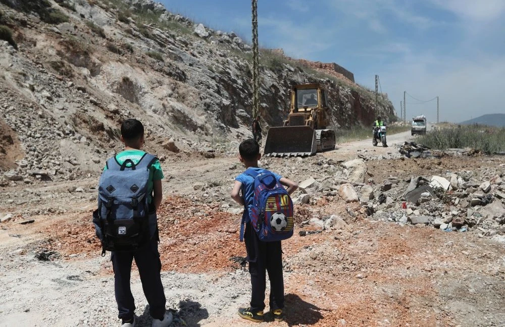 A bulldozer fills a crater following Israeli airstrikes that targeted hilltops near Nabatieh town, south Lebanon, Thursday, May 8, 2025. (AP Photo)