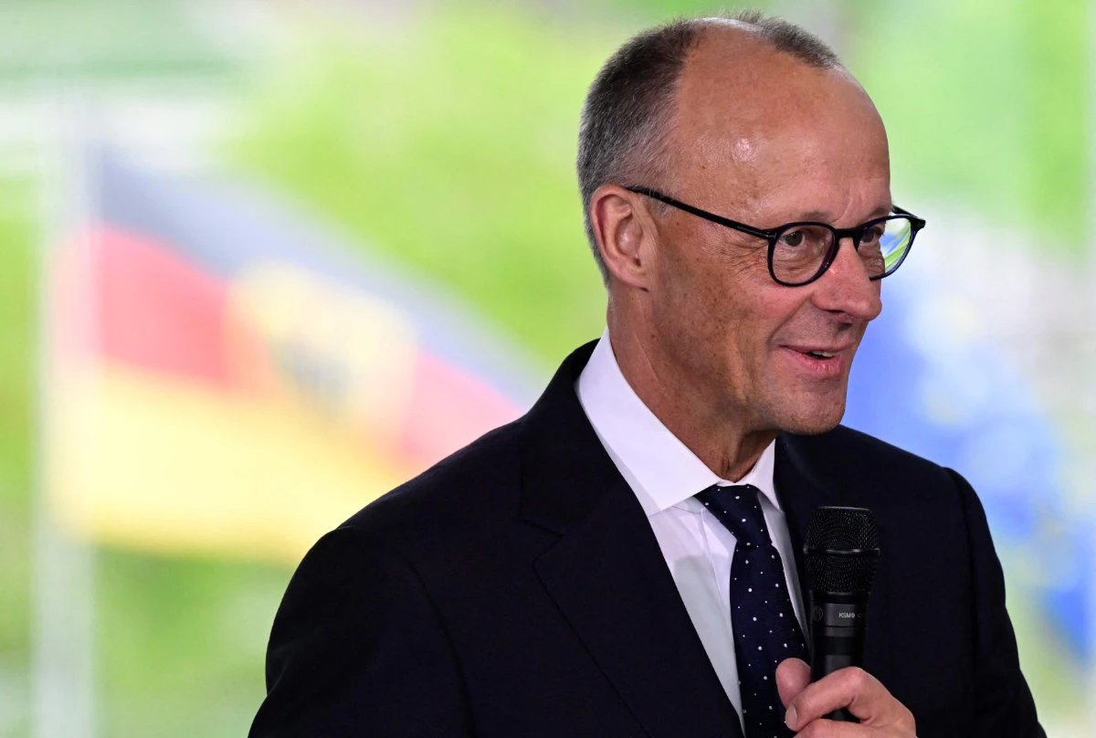German Chancellor Friedrich Merz addresses young people who took part in the youth4peace project in the Chancellery in Berlin on May 8, 2025. (AFP)
