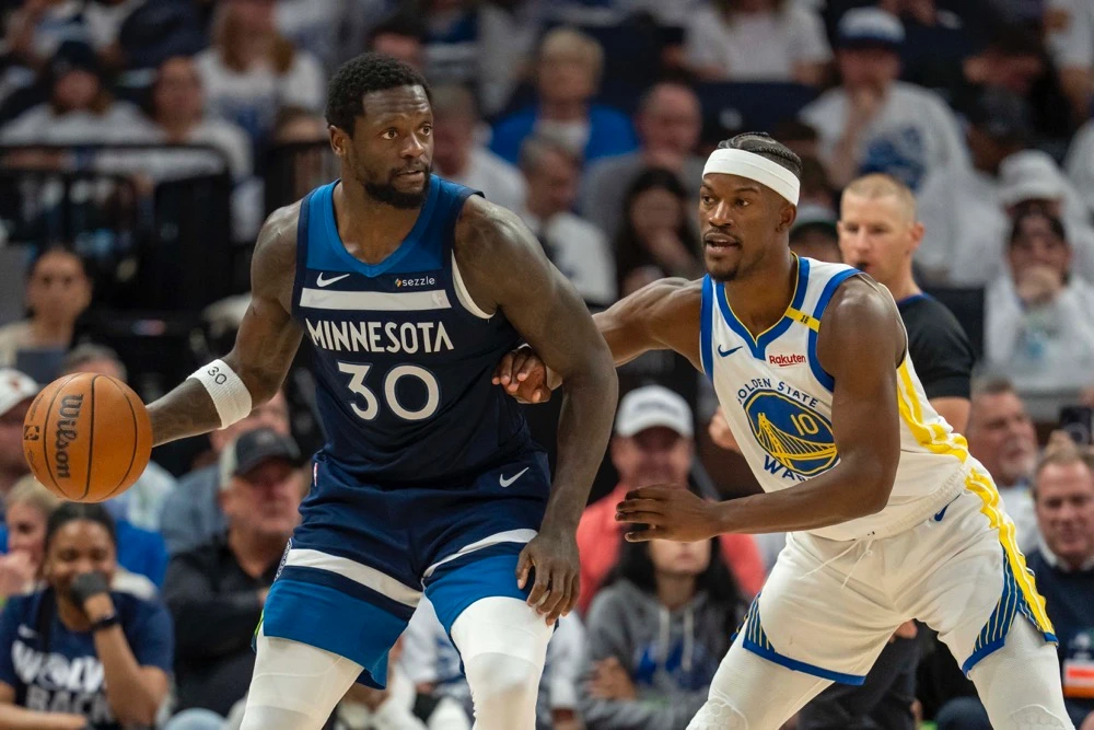 Julius Randle, left, led the scoring for Minnesota with 24 points. (Imagn Images/Reuters)