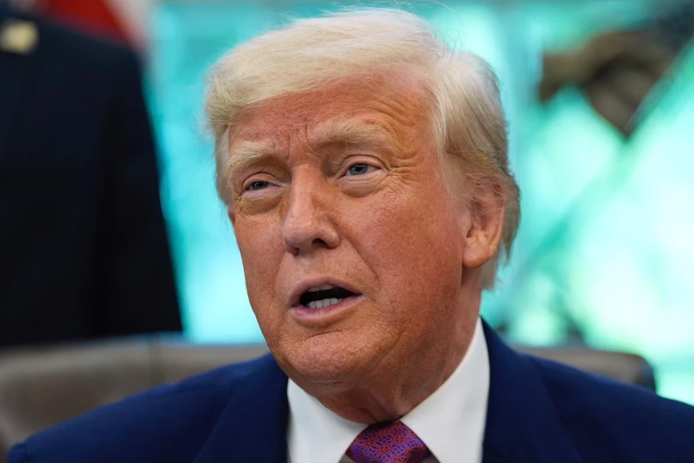 President Donald Trump speaks with reporters as he signs an executive order in the Oval Office of the White House, Friday, May 9, 2025. (AP)