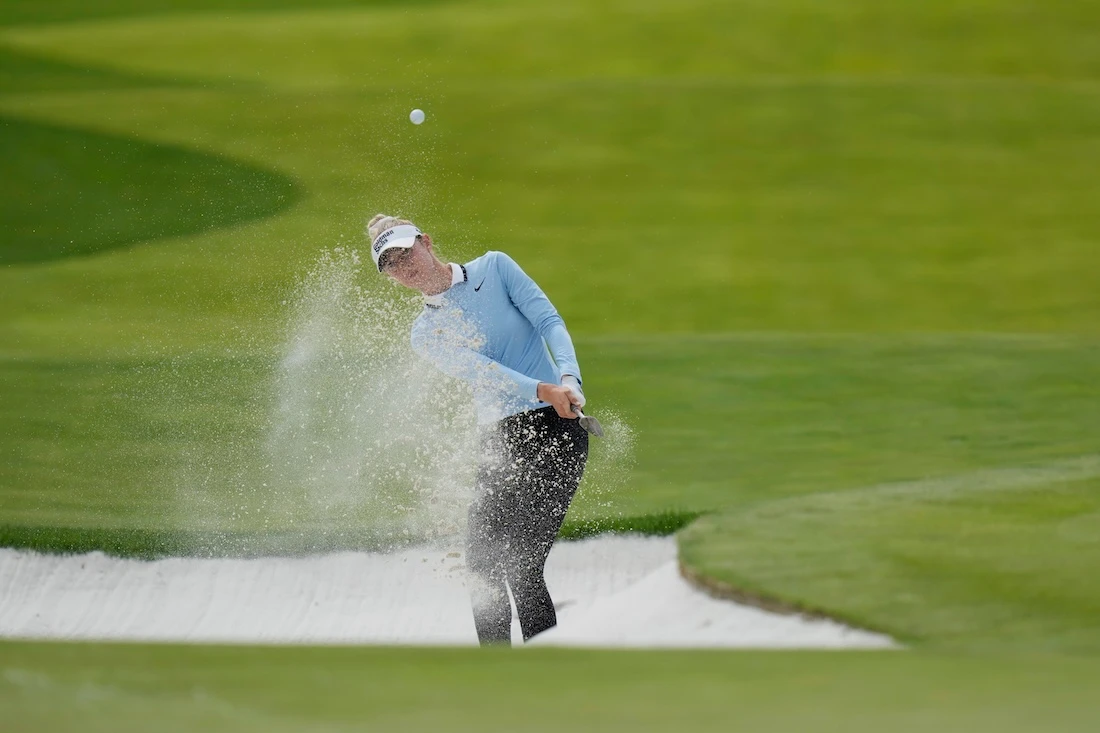 Nelly Korda hits from a bunker toward the seventh fairwaya t the Mizuho Americas Open golf tournament in Jersey City, N.J. (AP)
