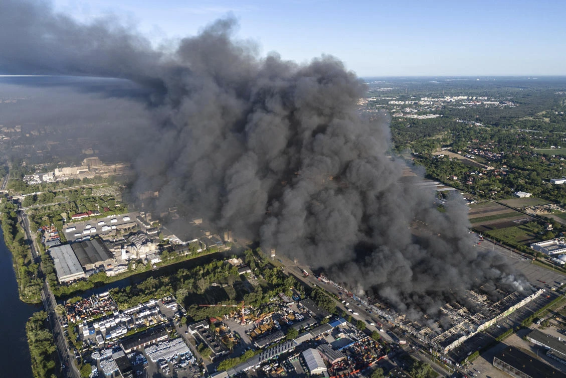 A fire burns from a vast shopping complex in Warsaw, Poland, May 12, 2024. (AP)