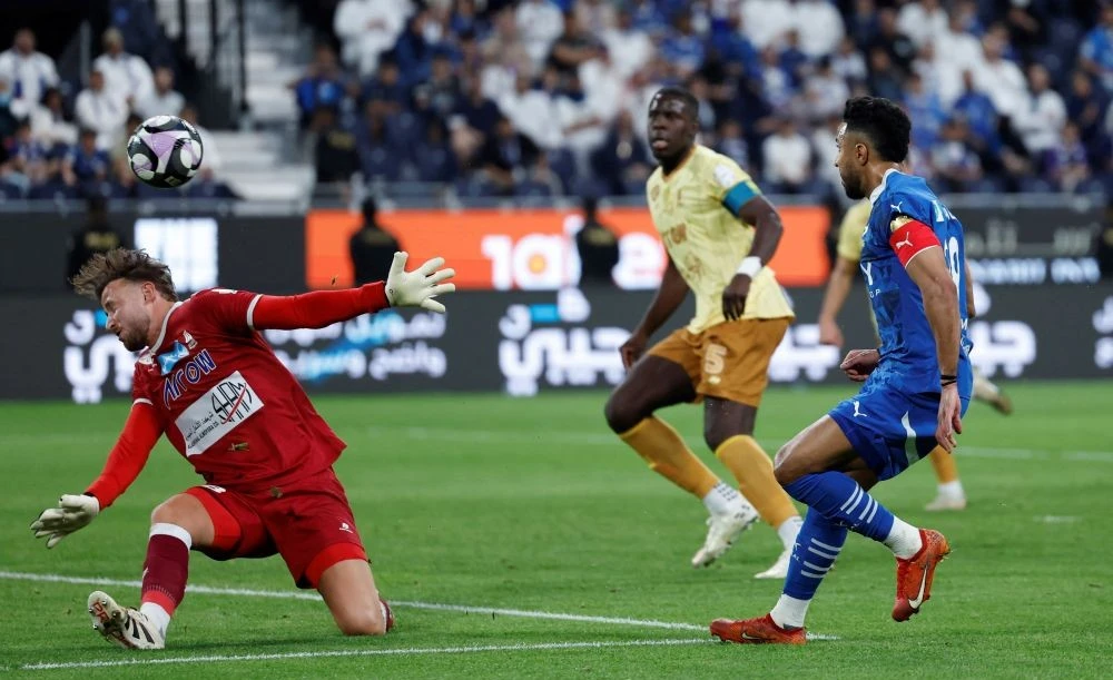 Salem Al-Dawsari scores Al-Hilal’s second goal against Al-Orobah at the Kingdom Arena, in Riyadh, Saudi Arabia, May 12, 2025. (Reuters)