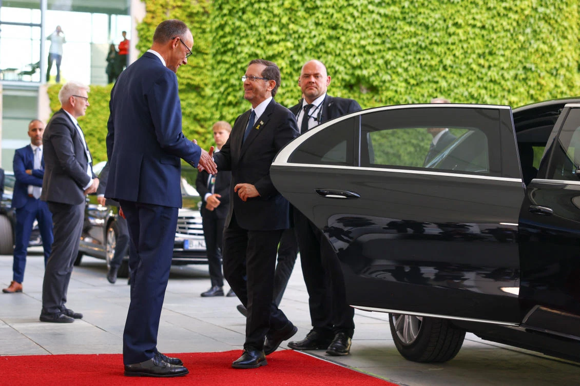 German Chancellor Friedrich Merz receives Israel’s President Isaac Herzog for talks at the Chancellery in Berlin, May 12, 2025. (Reuters)