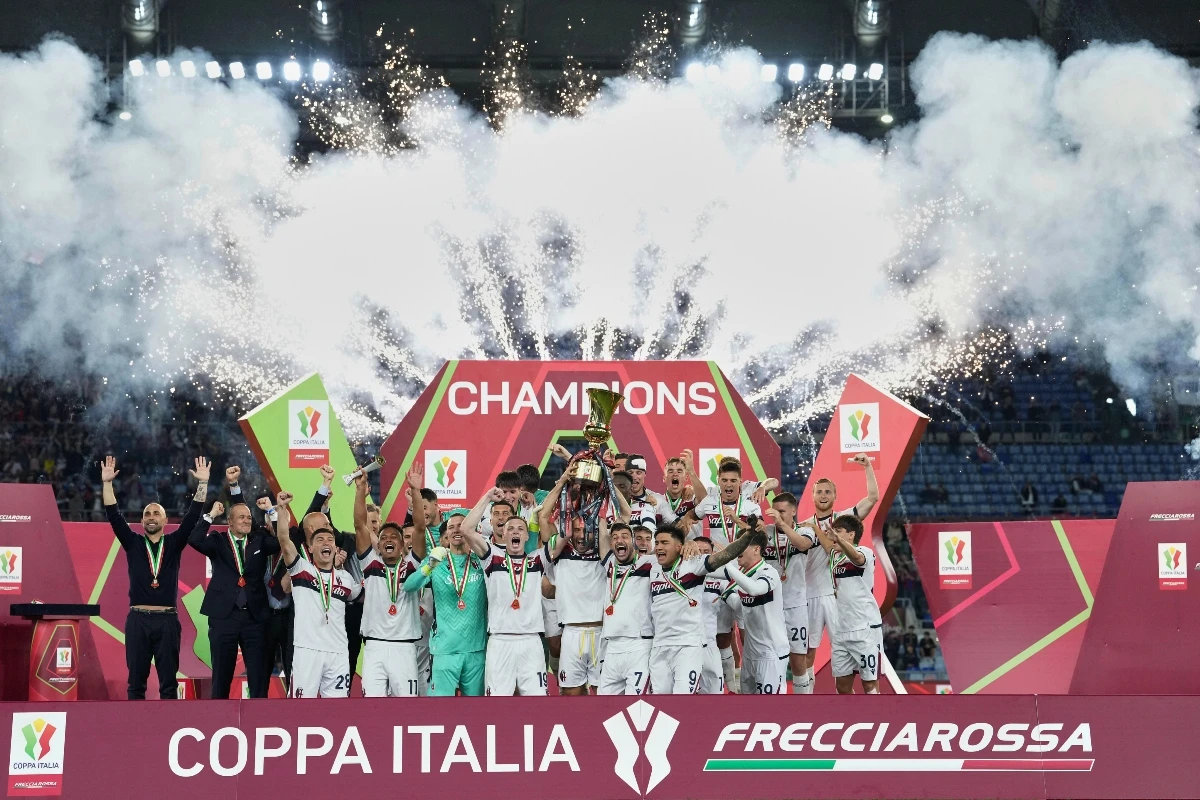 Bologna’s team players celebrate with the trophy during the Italian Cup final AC Milan and Bologna at Rome’s Olympic Stadium Wednesday. (LaPresse via AP)