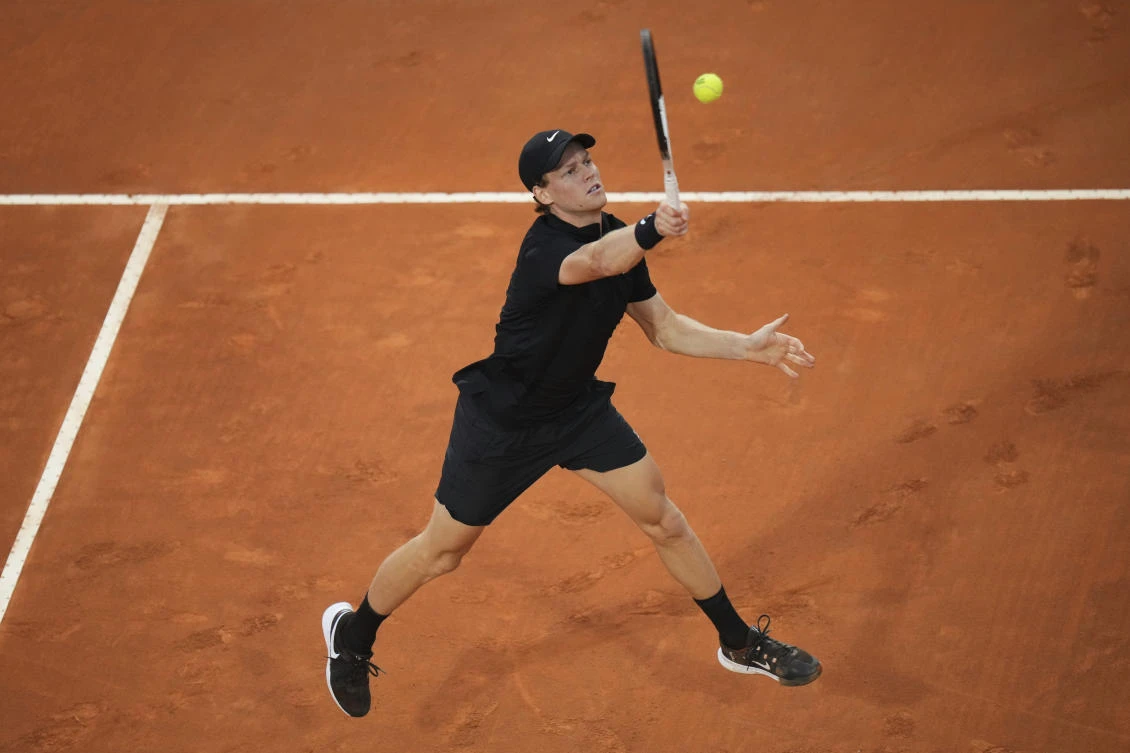 Italy’s Jannik Sinner replays a volley to Norway’s Casper Ruud, during their quarterfinal tennis match at the Italian Open, at the Foro Italico, in Rome, May 15, 2025. (AP)