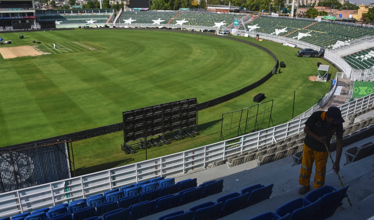 A worker cleans an enclosure of the Rawalpindi Cricket Stadium following the Pakistan Super League resumption, in Rawalpindi Thursday. (AP)