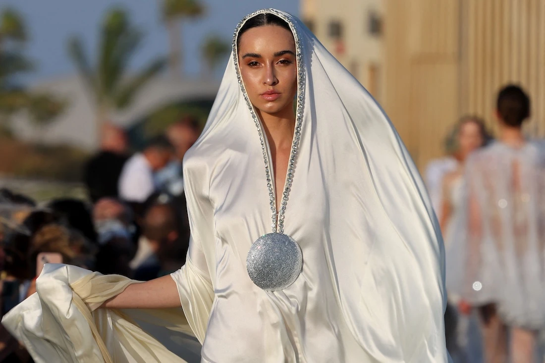 A model presents a creation of Saudi designer Tima Abid during the Red Sea Fashion Week in Saudi Arabia's Red Sea resort of Ummahat Island. (File/AFP)