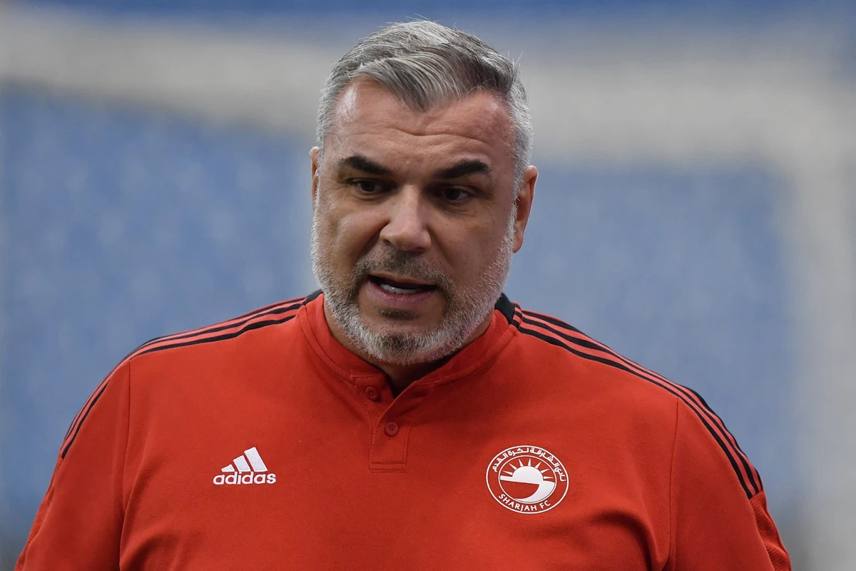 Sharjah's Romanian coach Cosmin Olaroiu (R) arrives for the AFC Champions League group A match between Tajikistan's Istiklol and UAE's Sharjah on April 27, 2022, at the King Fahd stadium in the Saudi capital Riyadh. (Photo by AFP)