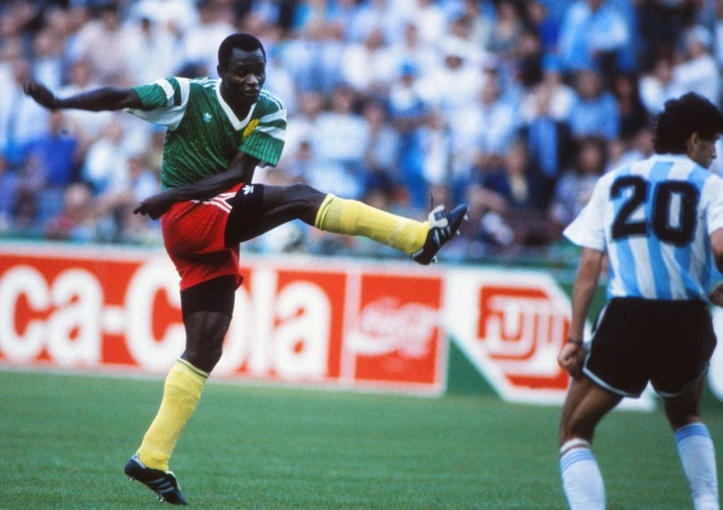 Emmanuel Kundé, Cameroon's defensive anchor on the first African team to reach the quarterfinals of the World Cup, has died, the country’s soccer federation said. (X/@AftvBelgium)