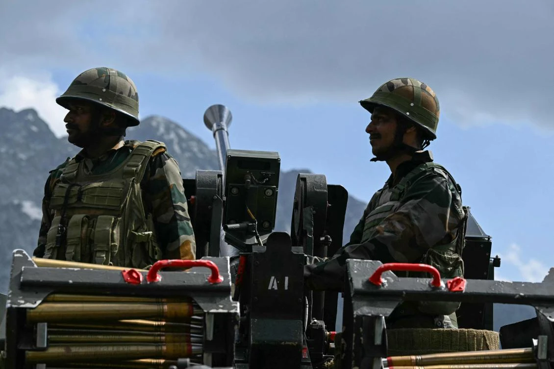 Indian army soldiers stand guard next to an anti-aircraft gun near the Line of Control (LoC) in India's Kashmir region on May 19, 2025. (AFP)