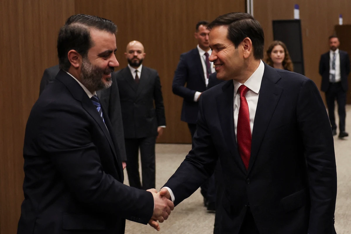 Syrian Foreign Minister Asaad Hassan al-Shibani (L) shakes hands with U.S. Secretary of State Marco Rubio at the NEST International Convention Center, in Antalya, May 15, 2025. (AFP)