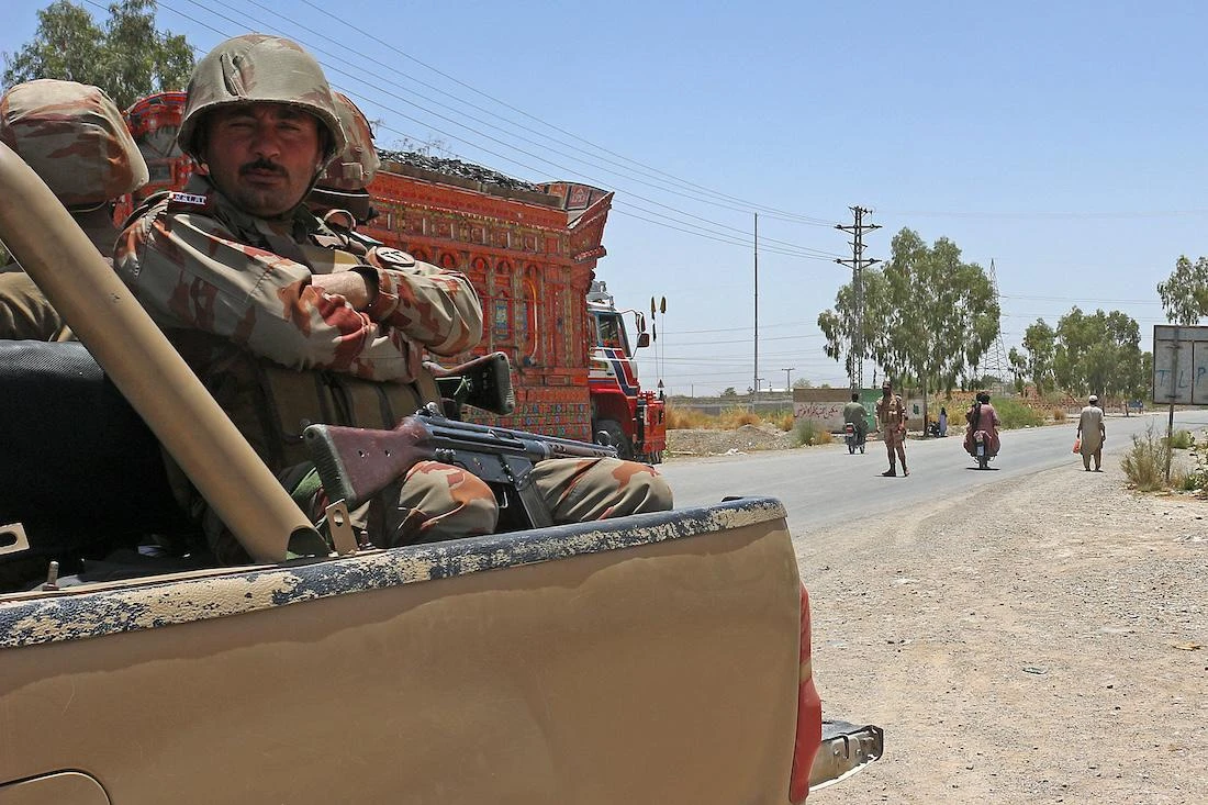 Security personnel guard along a street near the site of a school bus bombing in the Khuzdar district of Balochistan province . (File/AFP)