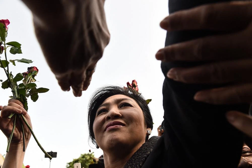 Self-exiled former premier Yingluck Shinawatra came to power in 2011 after a landslide election victory and resigned just days before her government was ousted in a coup in 2014. (AFP)