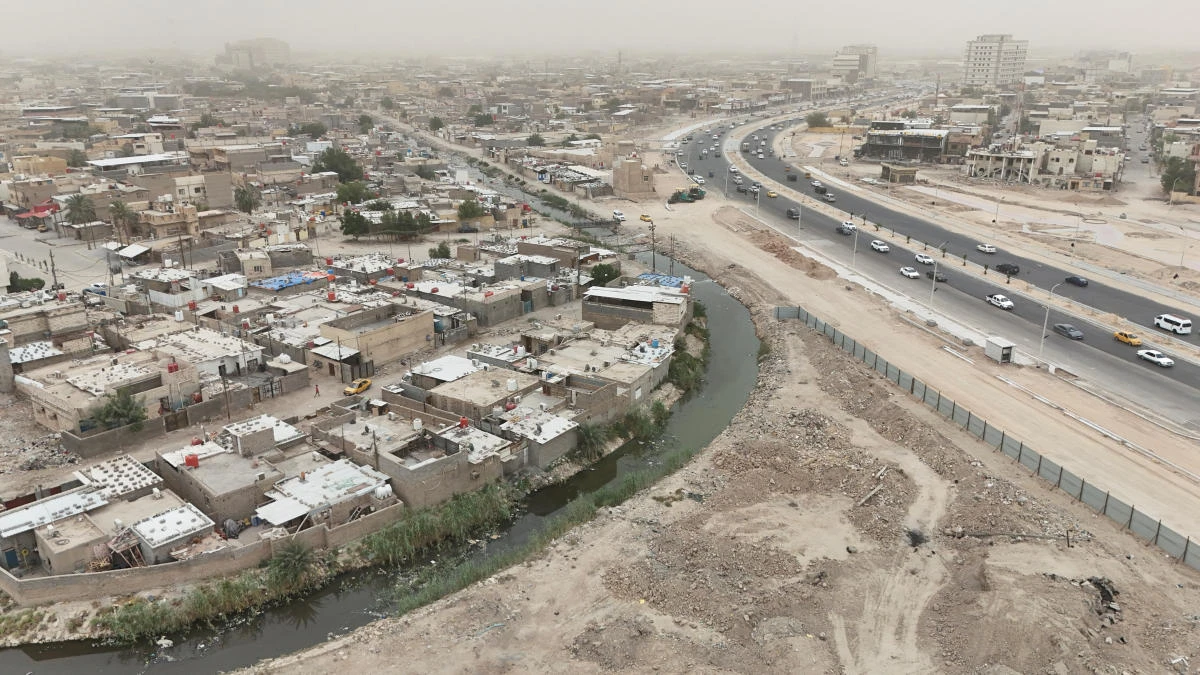 A drone view shows a polluted section of the al-Ashar River running through a residential neighborhood in Basra, Iraq, April 29, 2025. (REUTERS)