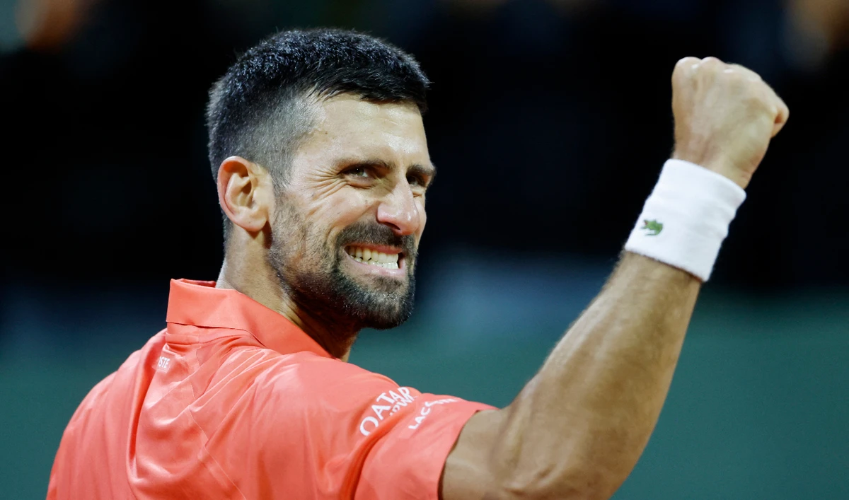 Serbia's Novak Djokovic celebrates after winning his quarter final match against Italy's Matteo Arnaldi. (Reuters)