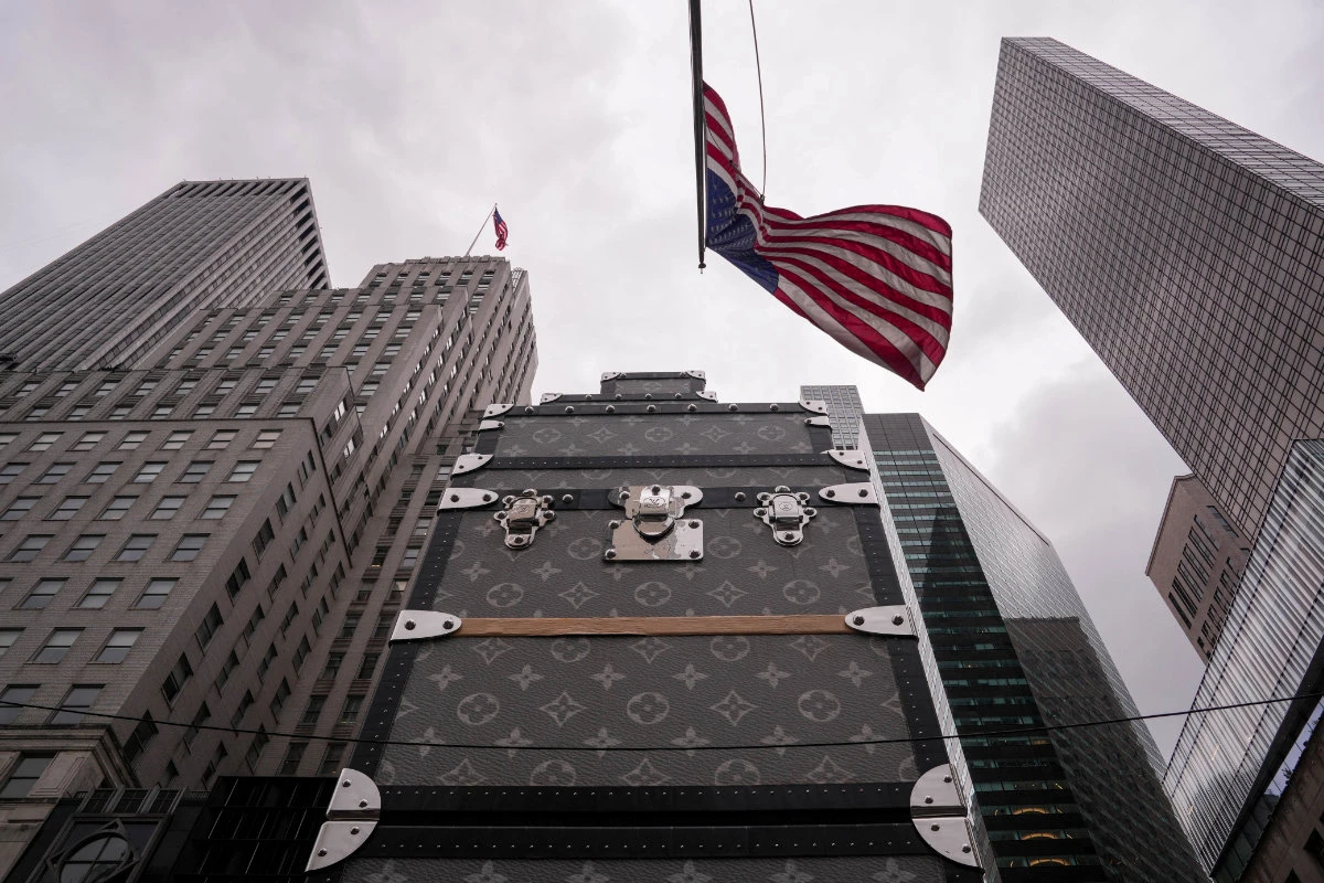 The US flag flies in front of the French luxury fashion house Louis Vuitton store on 5th Avenue in New York City on May 23, 2025. (REUTERS)
