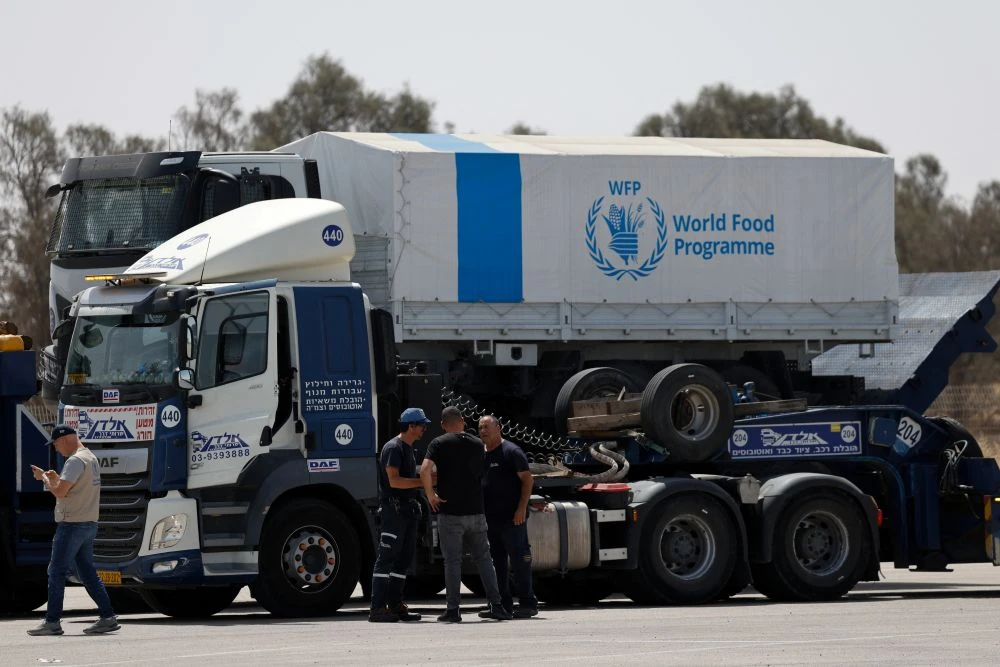 A WFP truck, which will be sent into Gaza empty for logistical purposes, is transported at the Kerem Shalom border crossing between Israel and the Gaza Strip, May 26, 2025. (Reuters)